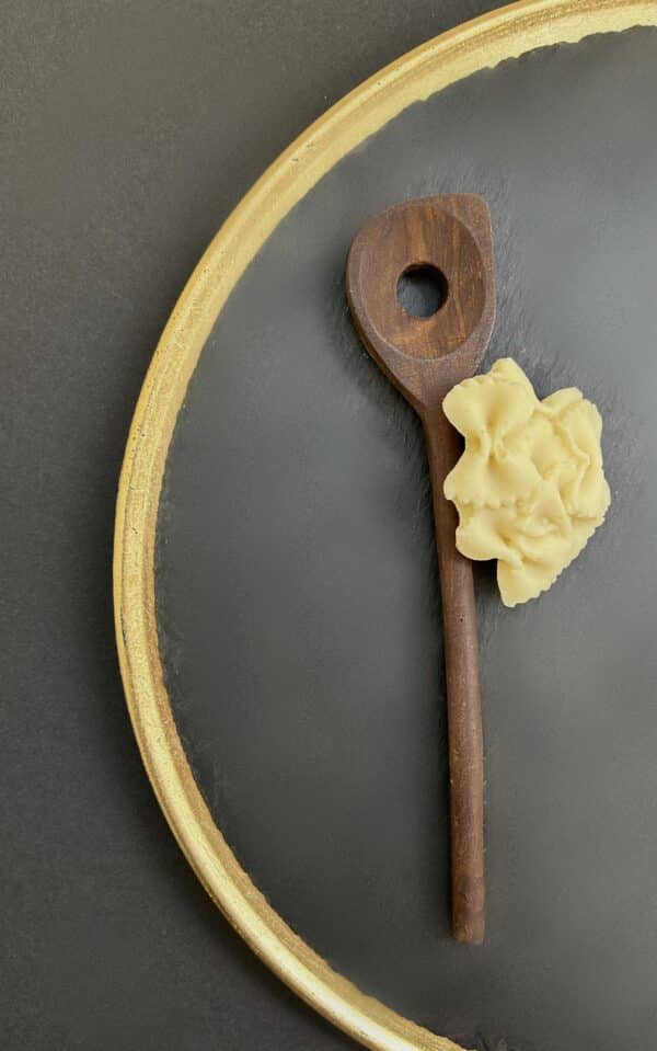 Wooden spoon with pasta